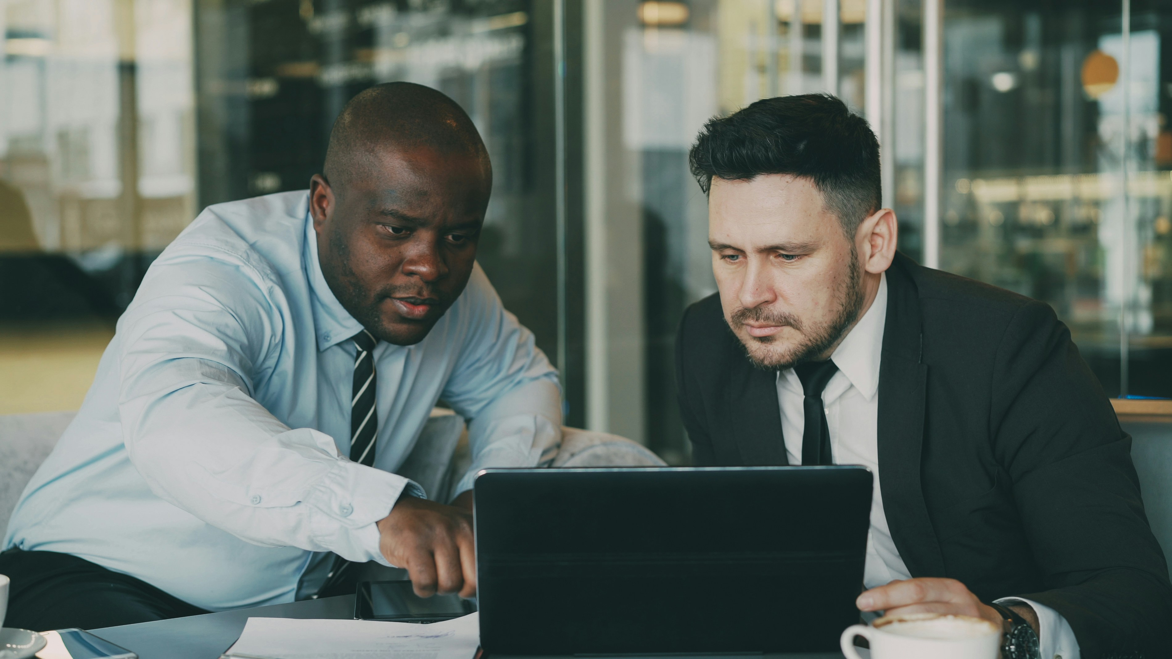 Two advocates reviewing legal documents together